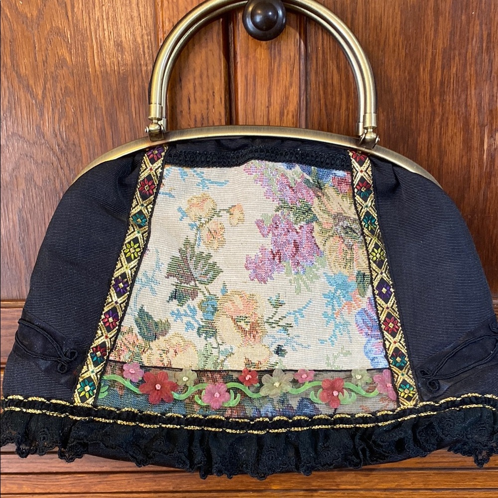 Black Floral Clutch with Dome Shape and Decorative Trim